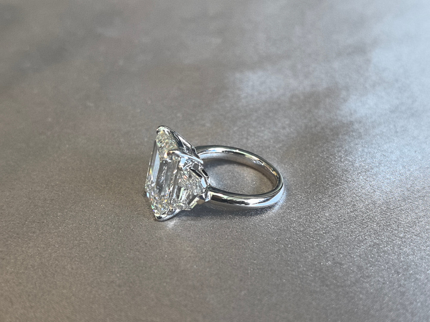 Emerald-Center Trilogy Ring with Cadillac Sidestones