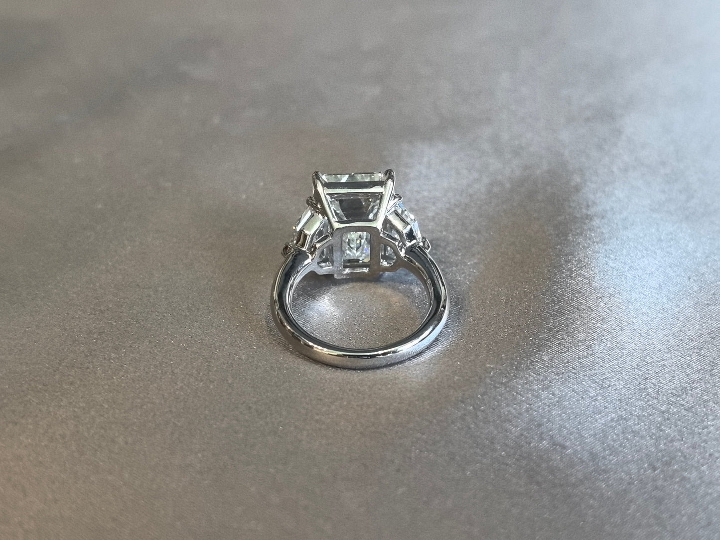 Emerald-Center Trilogy Ring with Cadillac Sidestones