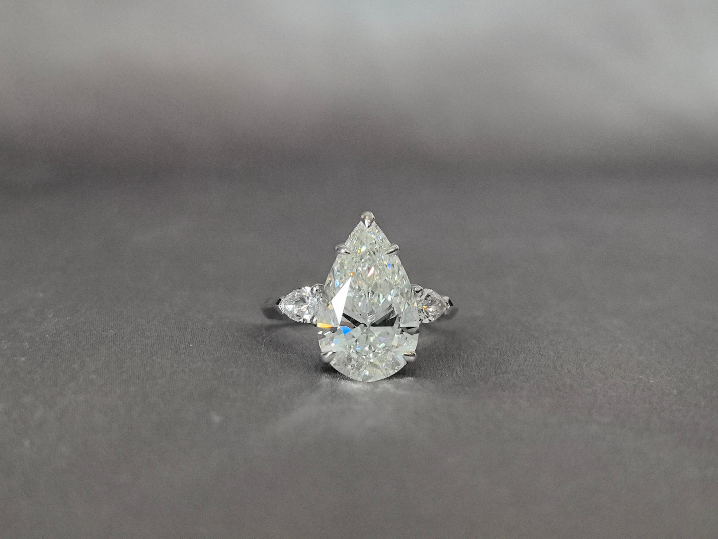 Pear-Center Trilogy Ring | Pear Sidestones | Fluid Harmony | Lab-Grown Diamonds