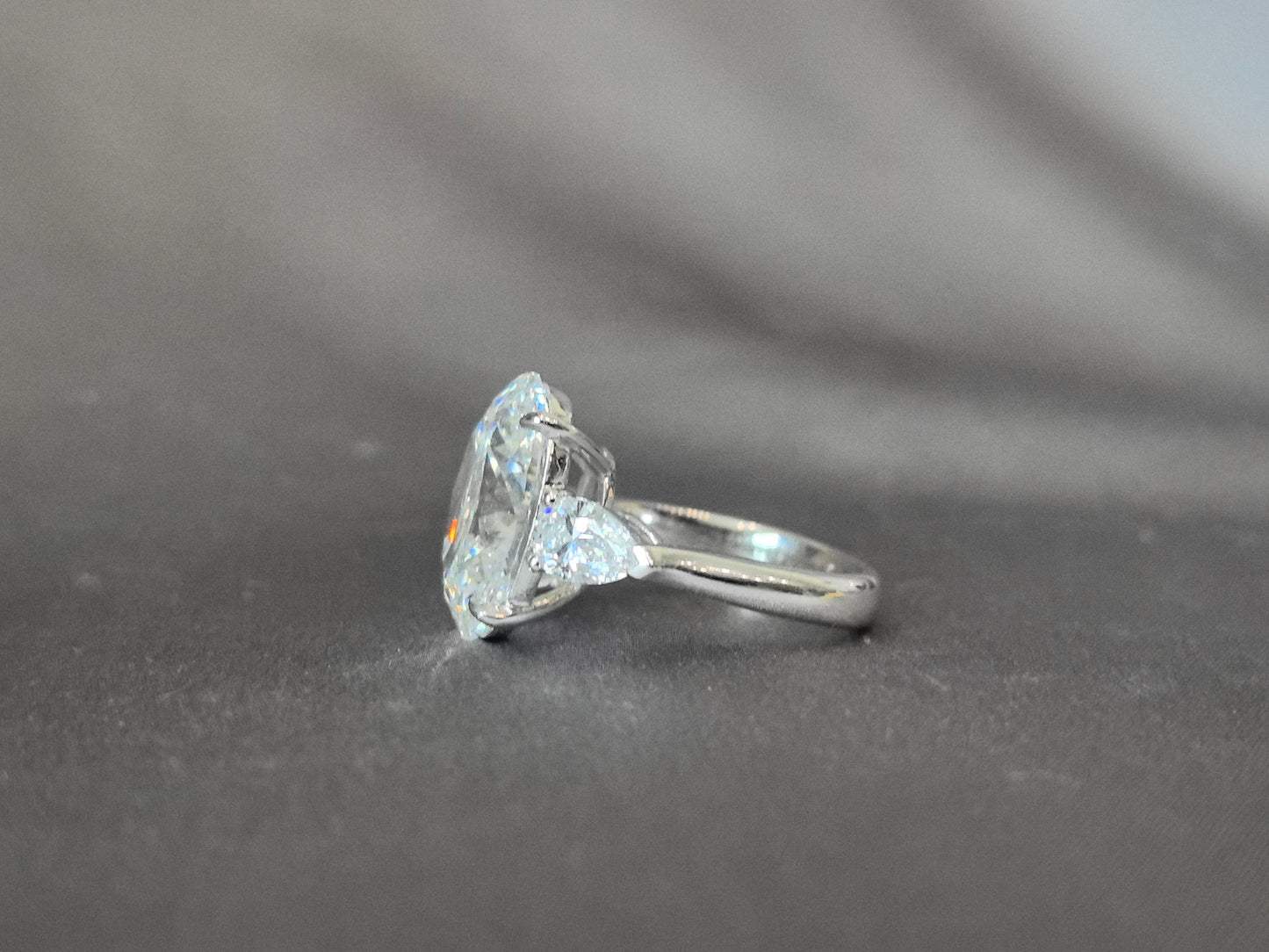 Oval-Center Trilogy Ring with Pear Sidestones