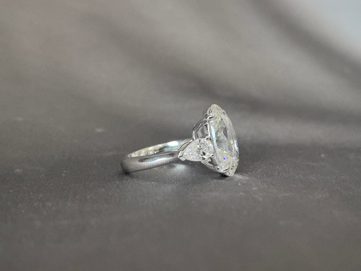 Oval-Center Trilogy Ring with Pear Sidestones