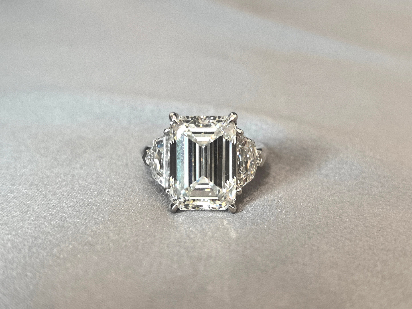 Emerald-Center Trilogy Ring with Cadillac Sidestones